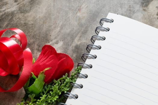 Valentines day background. Valentine hearts with open blank notebook on dark wooden background. Writing romantic letters