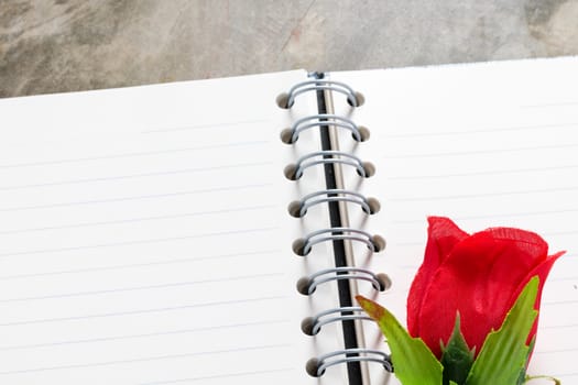 Valentines day background. Valentine hearts with open blank notebook on dark wooden background. Writing romantic letters