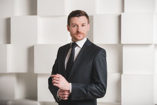 Portrait of man in black suit, groom, businessman concept