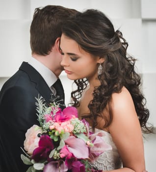 Bride and groom with bridal bouquet ready for wedding