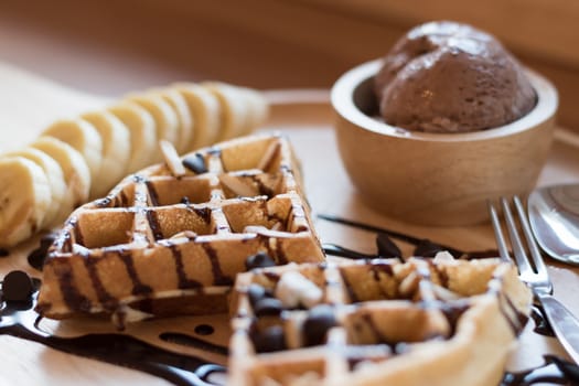 Belgian waffles with fruit and chocolate, forest fruit, all homemade, delicious batter