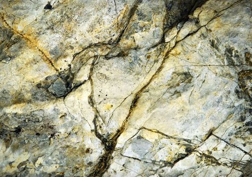abstract background or texture detail of an old cracked limestone rock