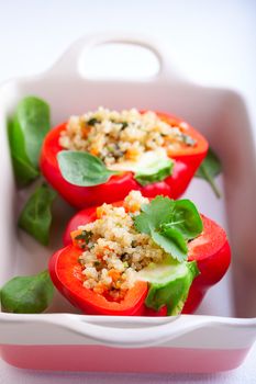 Stuffed red peppers filled with quinoa and vegetables