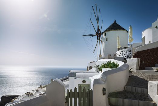 Oia town on Santorini island, Greece. Traditional and famous houses and churches with blue domes over the Caldera, Aegean sea