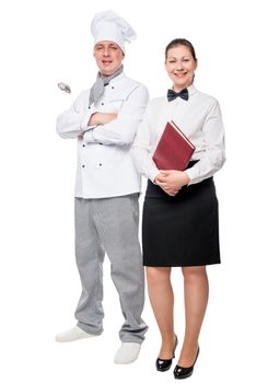 Happy chef and waiter posing in the studio on a white background