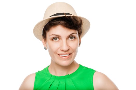 Horizontal portrait of a young brunette in a hat on a white background