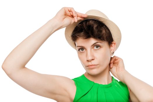 girl in the hat. Portrait on a white background in studio