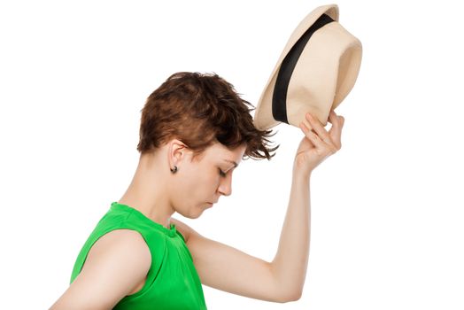 fitting of a straw hat on a white background