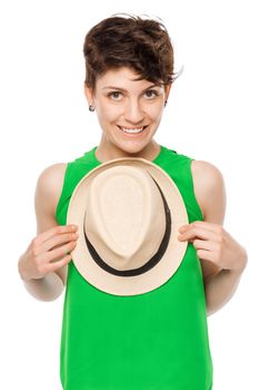 Vertical portrait of a young woman with a hat on a white background