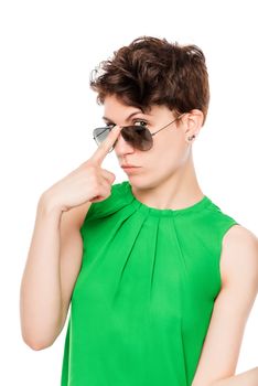 portrait of a woman in sunglasses stylish look on a white background