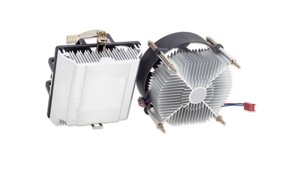 Bottom view of the two various active CPU coolers with the aluminum finned heatsinks and the fans on a light background
