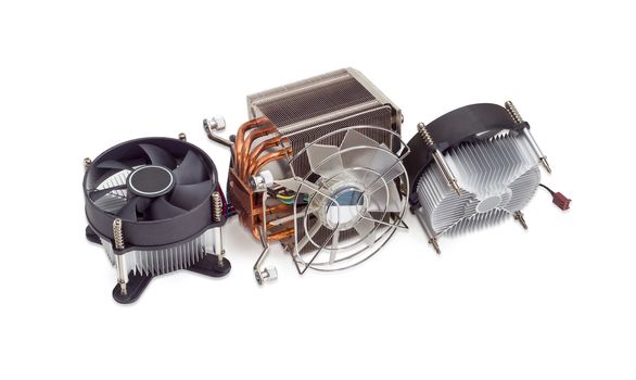 Active CPU cooler with large finned heatsink, fan, copper heat pipes and thermal pad, two coolers with aluminum finned heatsinks and fans on a light background
