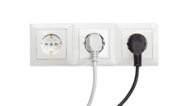 Three white socket outlets with two connected corresponding power plugs