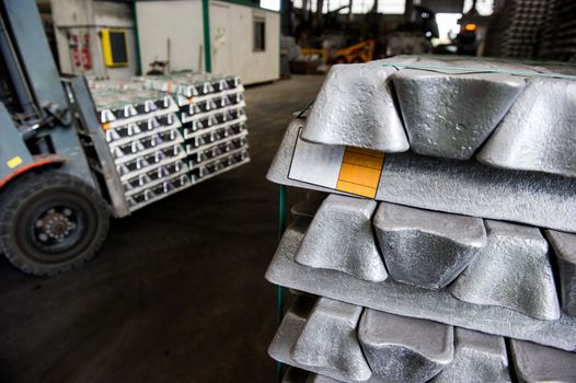Stack of raw aluminum ingots in aluminum profiles factory, France