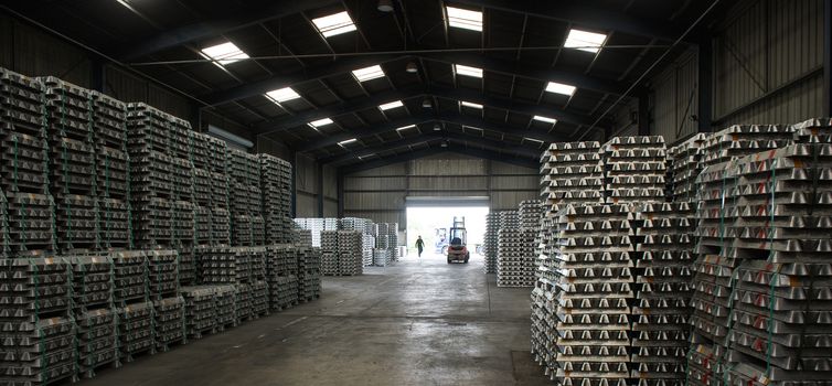 Stack of raw aluminum ingots in aluminum profiles factory, France