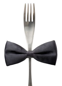 Concept of a black tie event, black bow tie on a fork