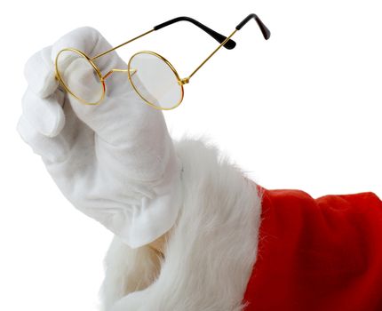 Santa picking up glasses to see