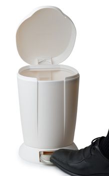 foot opening a pedal bin isolated on a white background