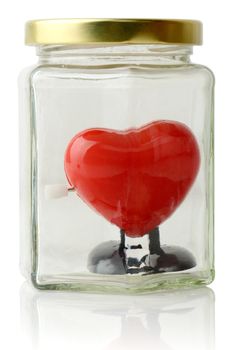 Red heart protected in a jar isoalted on white