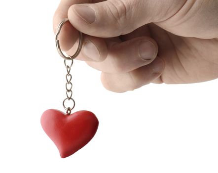 hand holding out a keyring with heart, isolated on a white background