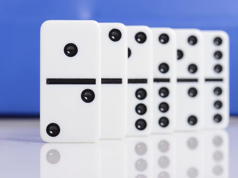 line of dominos with number one at the front