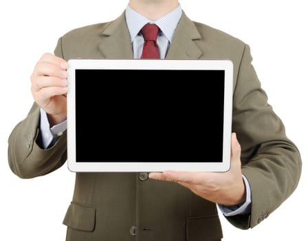 Businessman in suit holding up a tablet pc with blank screen for copy space