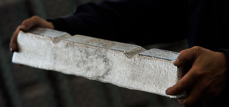 Stack of raw aluminum ingots in aluminum profiles factory, France