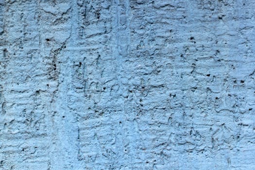 old stone background with cracked blue paint