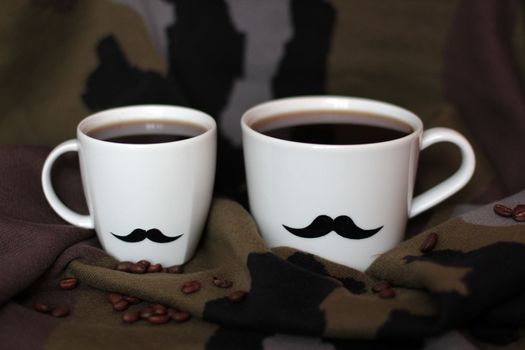 two men's cups with mustaches on a background of coffee and khaki