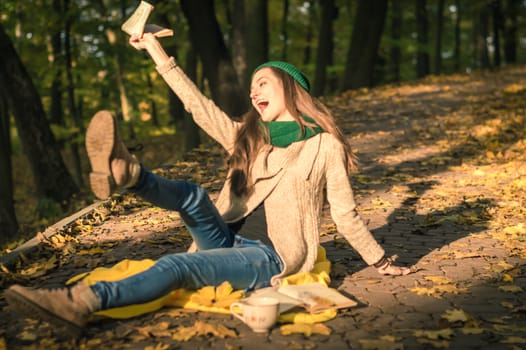 girl enjoys reading a book in the Park