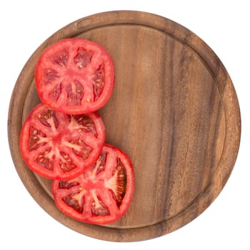 Chopped tomatoes on cutting board. Top view.