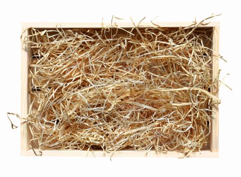 Wooden box with shavings. View from top. Wine empty packaging. Isolated with path on white.