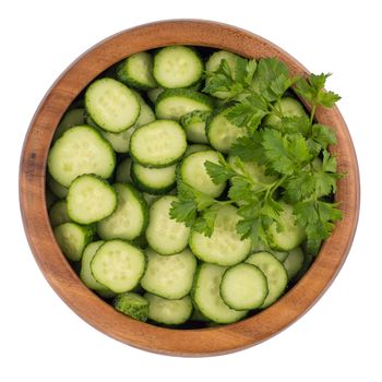 Top view Fresh slice cucumber in wood bowl on white background