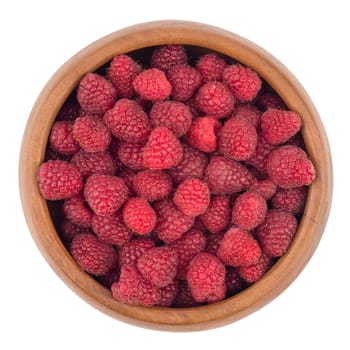 raspberries in wooden bowl isolated on white background cutout. Top view.