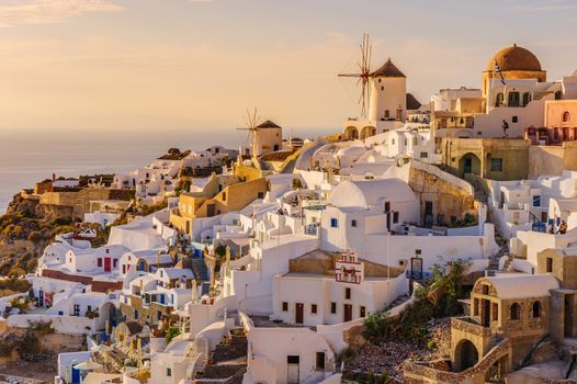 Famous view of Oia village at the Island Santorini, Greece in sunset rays