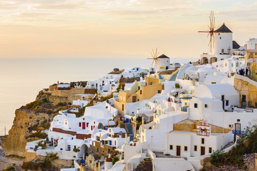 Famous view of Oia village at the Island Santorini, Greece in sunset rays