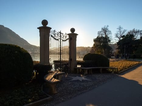 Lugano, Switzerland. Old gate for access to the lake of the park Ciani oldest botanical garden. The park is famous and visited by many tourists every year.