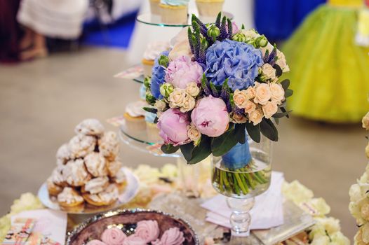 beautiful decor of flowers on a wedding table in a restaurant.