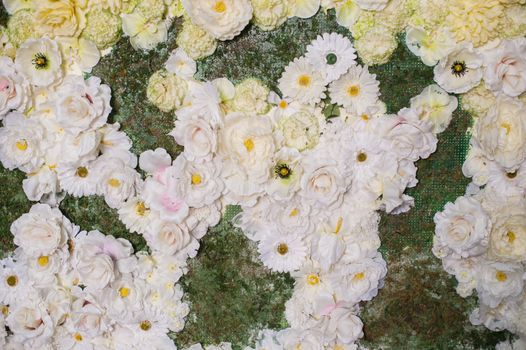 decor of white flowers for wedding ceremony.