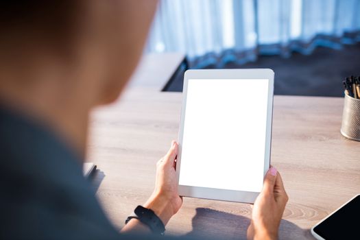 Business people using a tablet computer in office