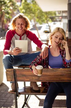 Customer using a tablet computer on am outdoor coffee