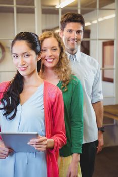 Business people posing together at work