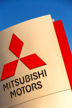 SAMARA, RUSSIA - MAY 14, 2016: Official dealership sign of Mitsubishi against the blue sky. Mitsubishi Motors Corporation is a Japanese automotive manufacturer