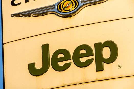 La rochelle, France - August 30, 2016: Official dealership sign of Jeep against the blue sky. Jeep is a brand of American automobiles that is a division of FCA US LLC (formerly Chrysler Group, LLC), a wholly owned subsidiary of Fiat Chrysler Automobiles