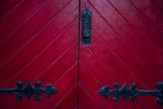 old red wooden door outside an American house in New England