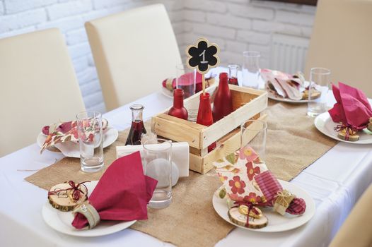 beautiful table setting wedding table in a restaurant in the rustic style.