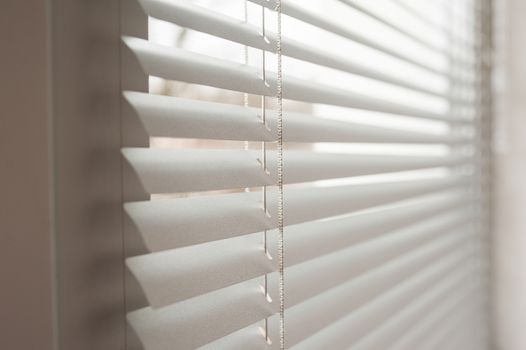 white metal blinds in the office at day