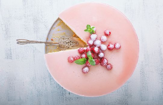 Raspberry yogurt cake on a wooden surface