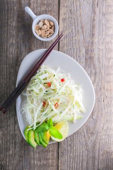 Spicy kohlrabi noodles, dressing: fish sauce, vinegar rices, lime garlic and ginger