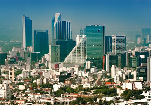 Aerial view of a neighborhood called Colonia Juarez in Mexico City, Mexico, on a sunny morning with some haze.